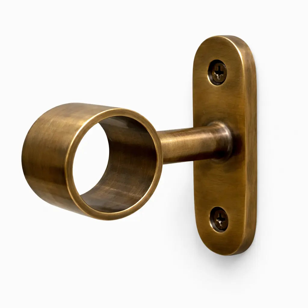Bronze curtain rod bracket on a white background