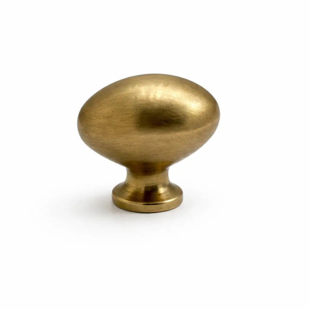 Brass cabinet knob on a white background