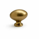Brass cabinet knob on a white background
